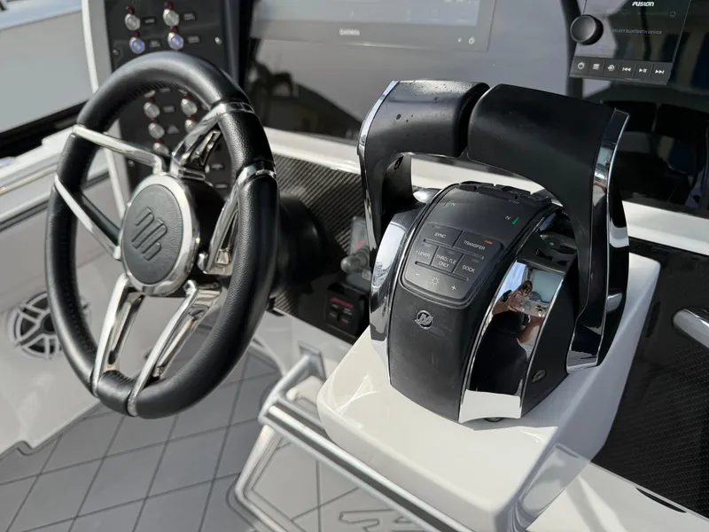 Slide: The Image of Steering wheel and controls of 2016 Nor-Tech 392 Super Fish Center Console boat. - 38