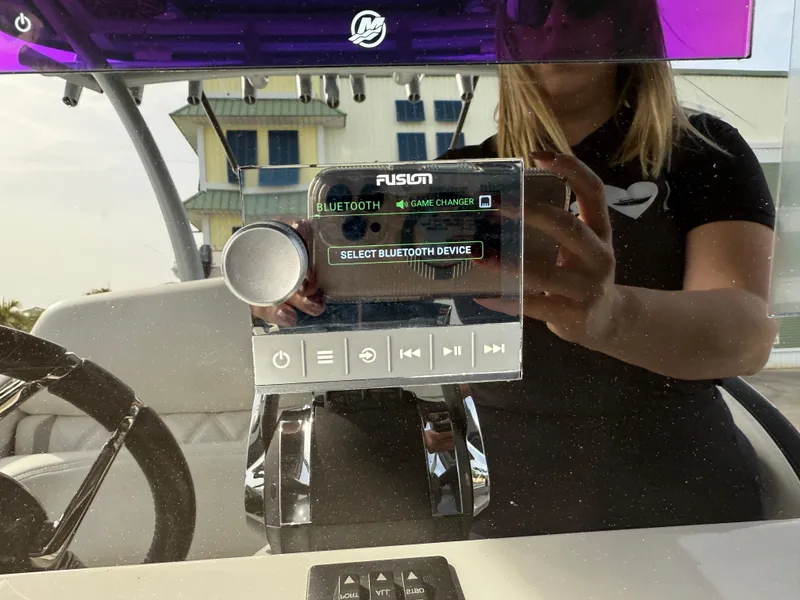 Slide: The Image of Fusion Bluetooth audio system on 2016 Nor-Tech 392 Super Fish Center Console boat dashboard. - 39