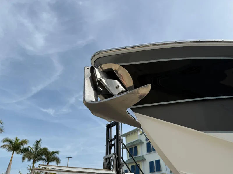 Slide: The Image of 2016 Nor-Tech 392 Super Fish Center Console boat bow with anchor, under clear sky. - 4