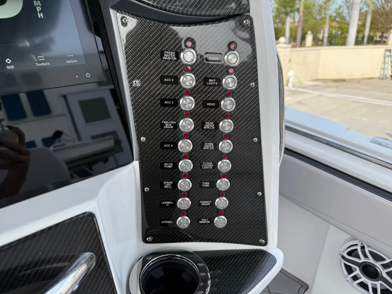 Slide: The Image of Control panel of 2016 Nor-Tech 392 Super Fish Center Console boat. - 42