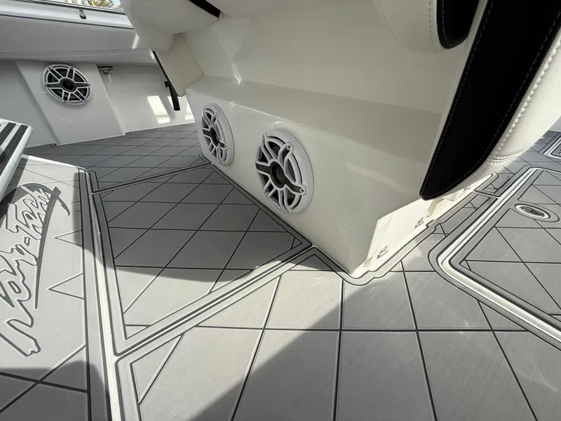 Slide: The Image of 2016 Nor-Tech 392 Super Fish Center Console with custom flooring and built-in speakers. - 49