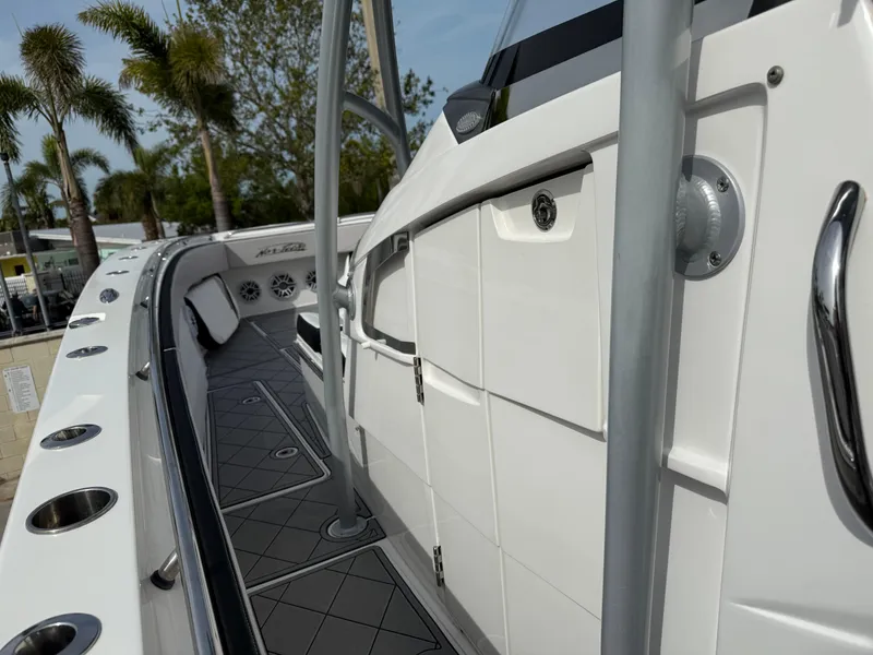Slide: The Image of 2016 Nor-Tech 392 Super Fish Center Console boat, sleek design, rod holders, and spacious deck. - 50