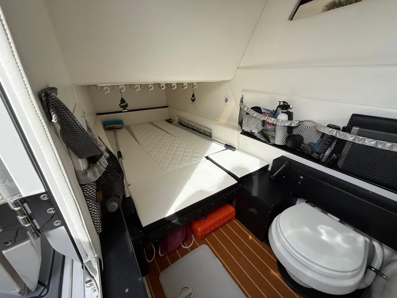 Slide: The Image of 2016 Nor-Tech 392 Super Fish Center Console cabin interior with bed and storage. - 51