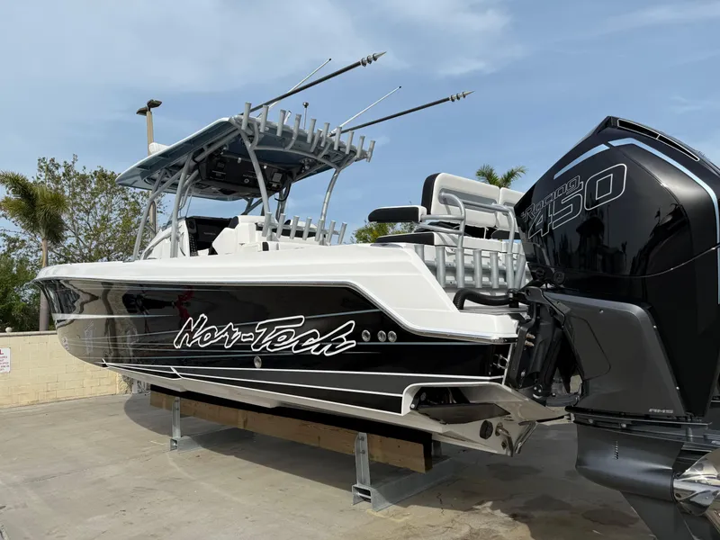 Slide: The Image of 2016 Nor-Tech 392 Super Fish Center Console boat with powerful outboard engines. - 6