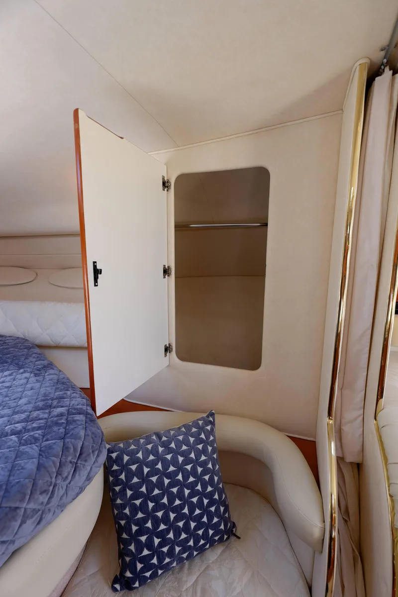 Slide: The Image of Interior of 2000 Sea Ray 340 Sundancer with open closet and seating area. - 20