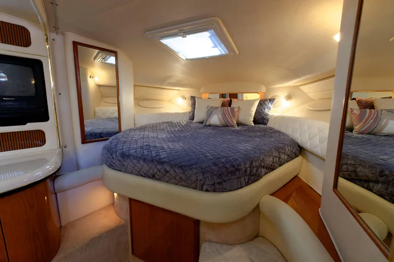Slide: The Image of Luxurious cabin interior of 2000 Sea Ray 340 Sundancer yacht with cozy bed. - 21