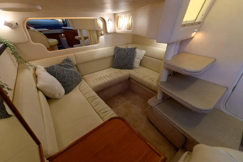 Slide: The Image of Interior of 2000 Sea Ray 340 Sundancer yacht with cozy seating and elegant design. - 22