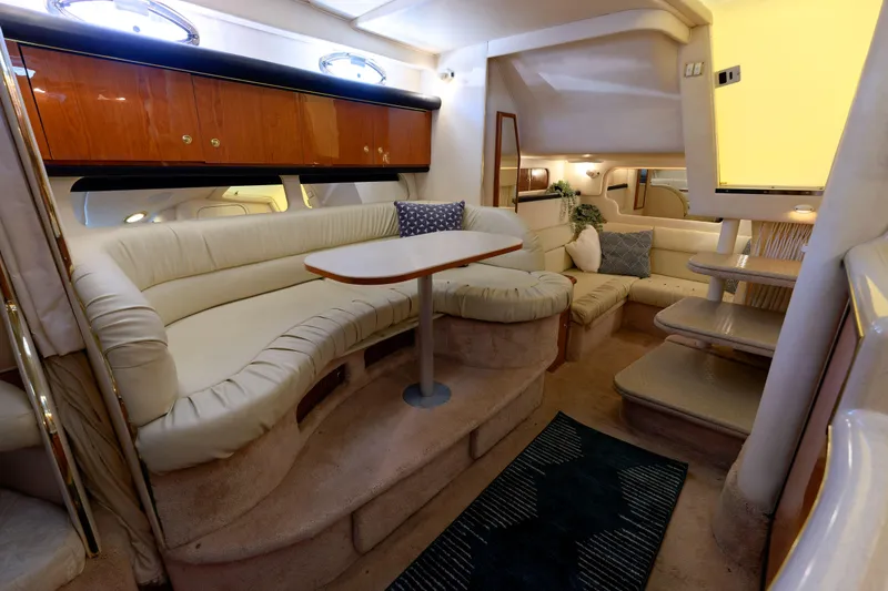 Slide: The Image of Interior of 2000 Sea Ray 340 Sundancer yacht with plush seating and elegant design. - 23