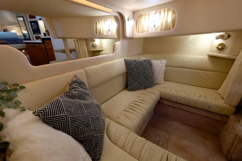 Slide: The Image of Luxurious interior of 2000 Sea Ray 340 Sundancer yacht with cozy seating and cushions. - 25