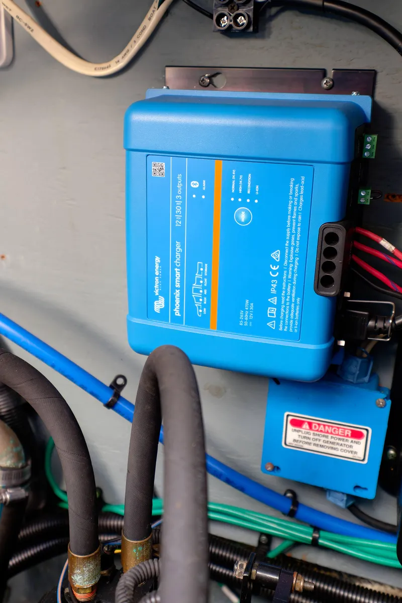 Slide: The Image of Blue power inverter installed on a 2000 Sea Ray 340 Sundancer boat. - 36
