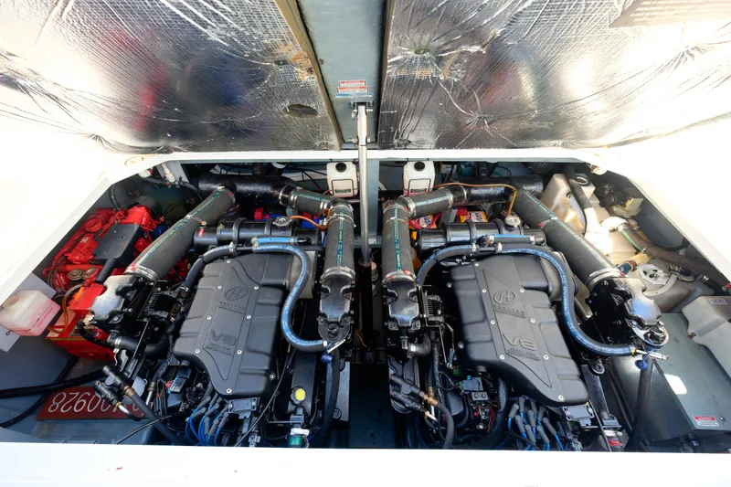 Slide: The Image of Engine compartment of a 2000 Sea Ray 340 Sundancer boat, showcasing dual engines. - 39