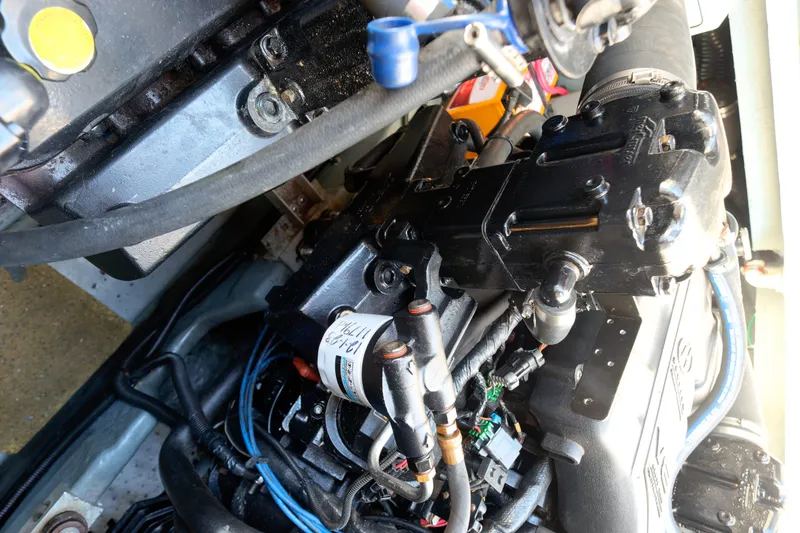 Slide: The Image of Engine of a 2000 Sea Ray 340 Sundancer boat, showcasing intricate mechanical components. - 43