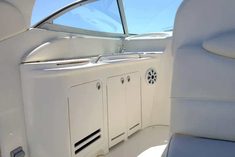 Slide: The Image of 2000 Sea Ray 340 Sundancer interior with sleek white cabinetry and modern design. - 9