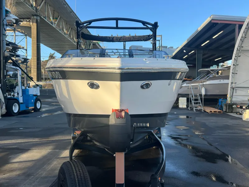 Slide: The Image of 2023 Cobalt R6 Surf boat on trailer in marina setting. - 4
