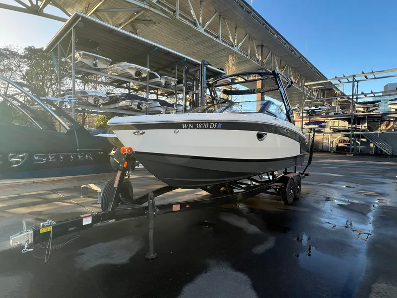 Slide: The Image of 2023 Cobalt R6 Surf boat on trailer in marina storage area. - 5