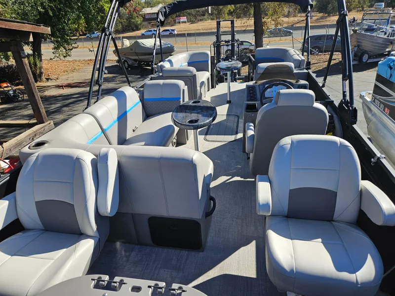 Slide: The Image of 2022 Apex Marine Qwest E CLASS 822 XRE TRITUNE pontoon boat interior with plush seating. - 13