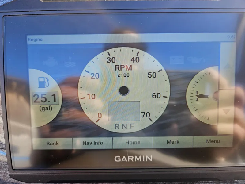 Slide: The Image of Garmin display showing RPM and fuel level on 2022 Apex Marine Qwest E CLASS 822 XRE TRITUNE. - 14