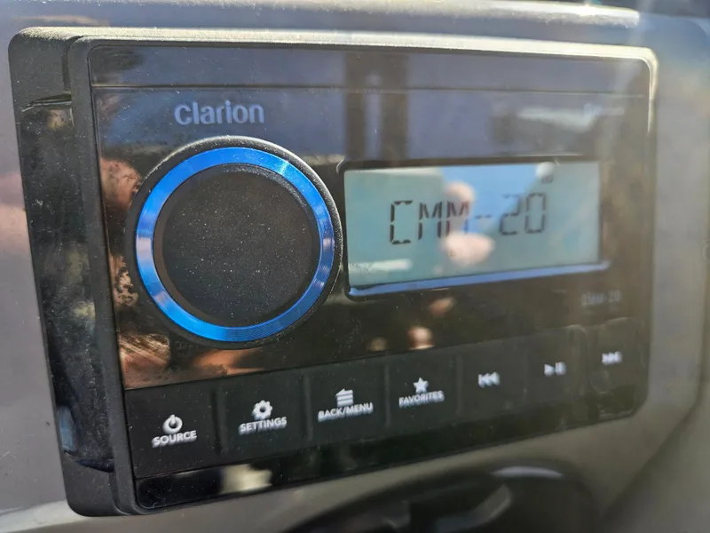 Slide: The Image of Clarion audio system in 2022 Apex Marine Qwest E CLASS 822 XRE TRITUNE boat. - 15