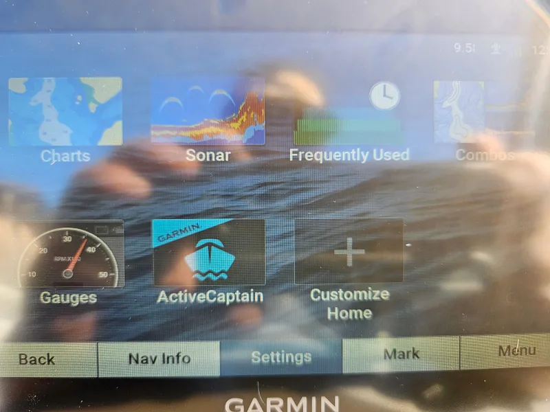 Slide: The Image of Garmin marine display showing navigation and sonar options on Apex Marine Qwest E CLASS 822 XRE TRITUNE. - 17