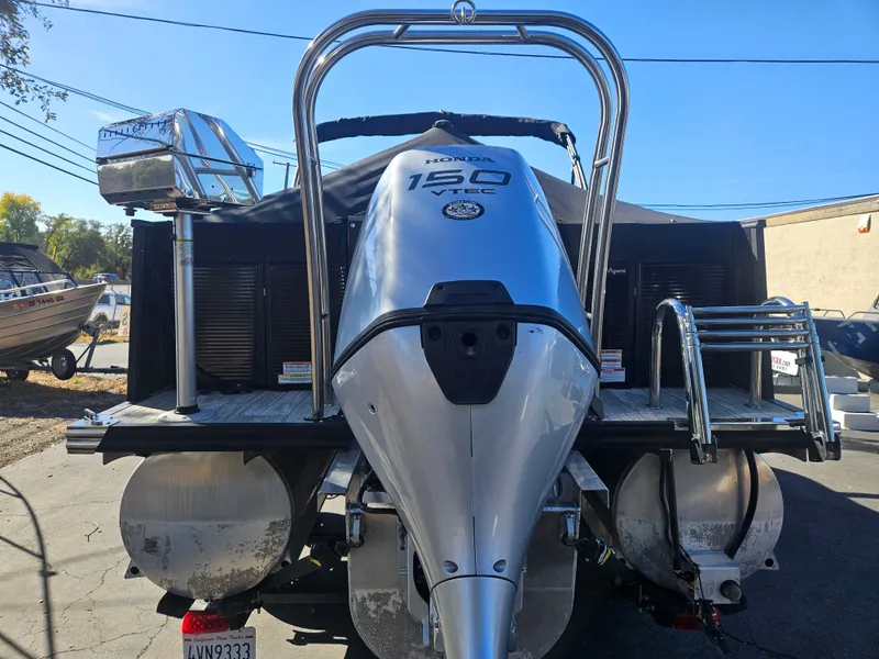 Slide: The Image of 2022 Apex Marine Qwest E CLASS 822 XRE TRITUNE with Yamaha 150 engine, rear view. - 3