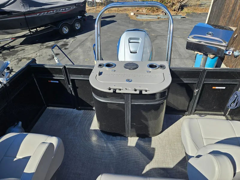 Slide: The Image of 2022 Apex Marine Qwest E CLASS 822 XRE TRITUNE interior with seating and control console. - 6