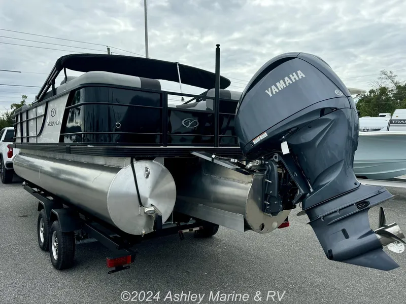 Slide: The Image of 2025 Veranda Relax Series 22RC pontoon boat with Yamaha outboard motor on trailer. - 5