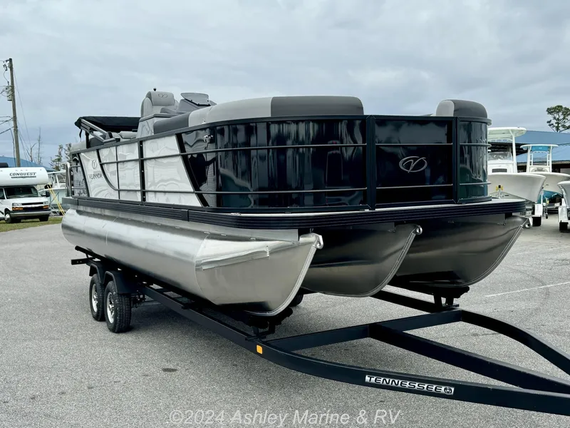 Slide: The Image of 2025 Veranda Relax Series 22RC pontoon boat on trailer in parking lot. - 12