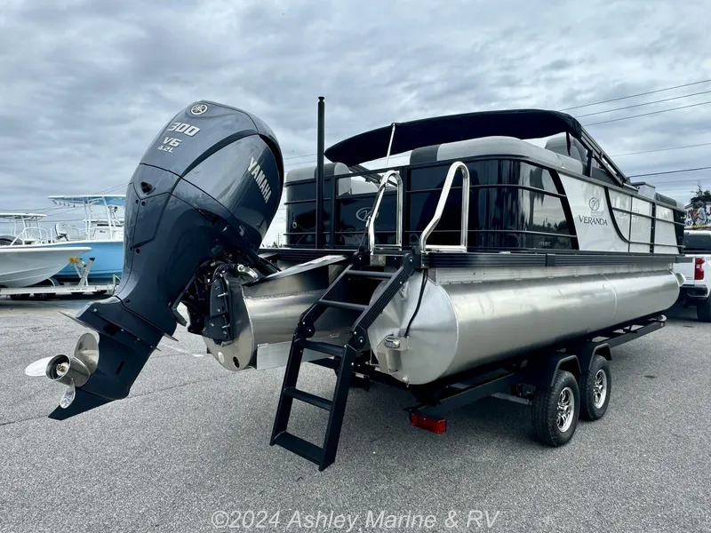 Slide: The Image of 2025 Veranda Relax Series 22RC pontoon boat with Yamaha 300 V6 engine on trailer. - 9