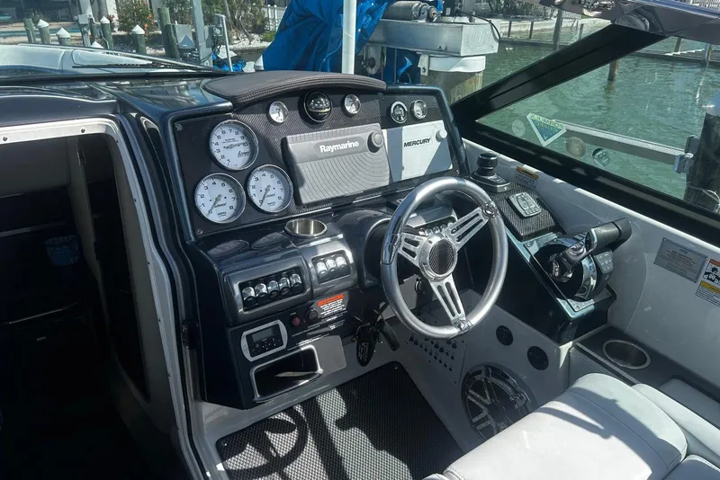 Slide: The Image of 2017 Formula 350 Crossover Bowrider OB dashboard with steering wheel and navigation controls. - 10