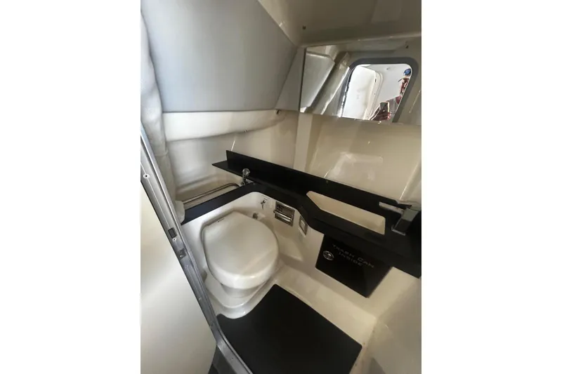 Slide: The Image of Interior of 2017 Formula 350 Crossover Bowrider OB boat bathroom with toilet and sink. - 18