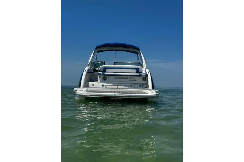 Slide: The Image of 2017 Formula 350 Crossover Bowrider OB on calm water, rear view. - 4