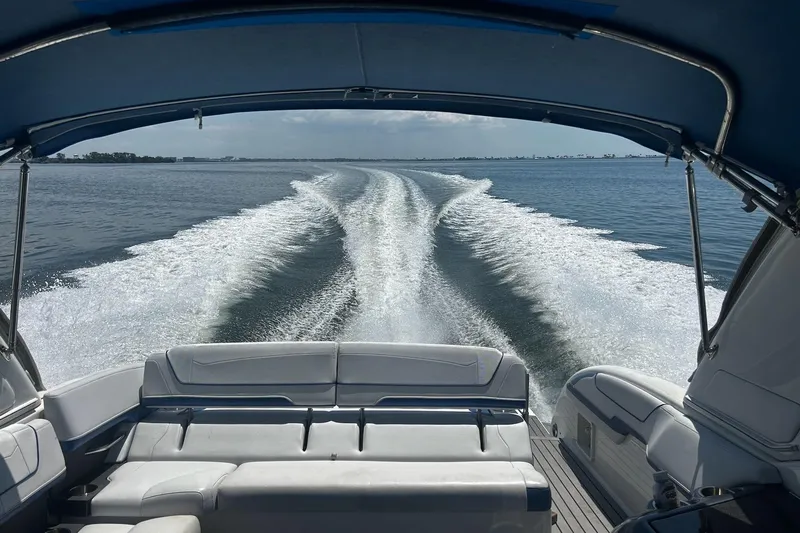 Slide: The Image of 2017 Formula 350 Crossover Bowrider OB cruising on open water, view from rear seating. - 6