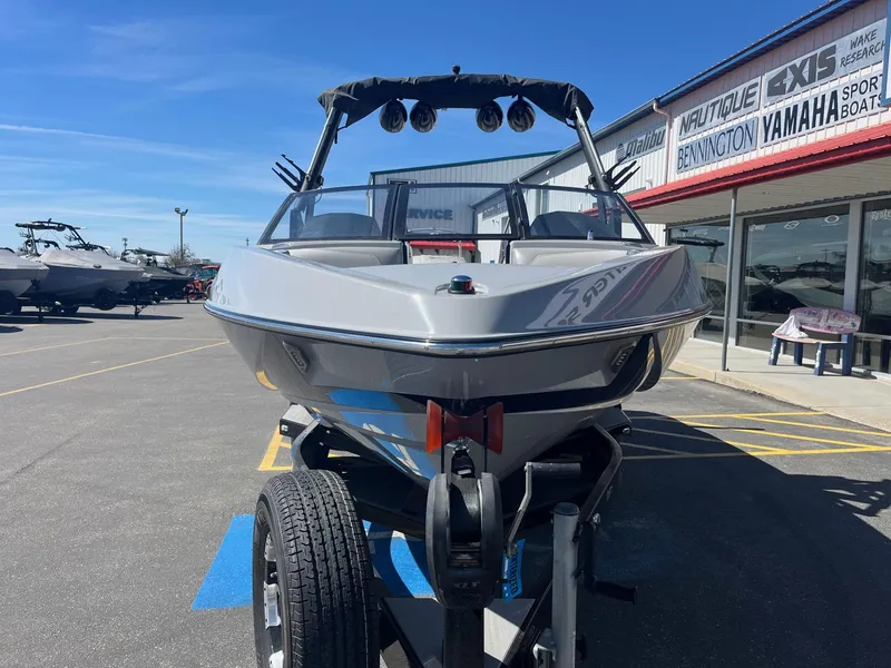 Slide: The Image of 2017 Axis Boats T22 on trailer at dealership, sunny day. - 11