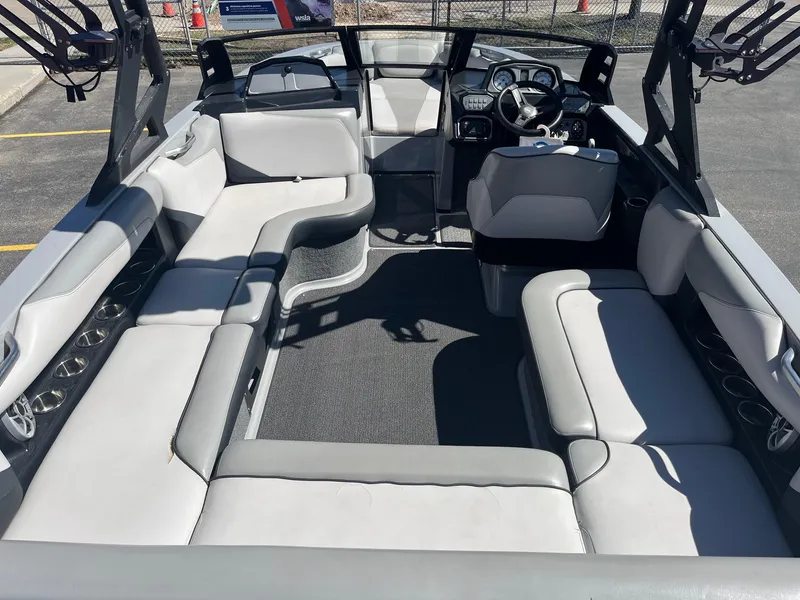 Slide: The Image of 2017 Axis Boats T22 interior with spacious seating and modern dashboard. - 19