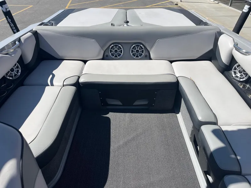 Slide: The Image of 2017 Axis Boats T22 interior with gray seating and built-in speakers. - 20