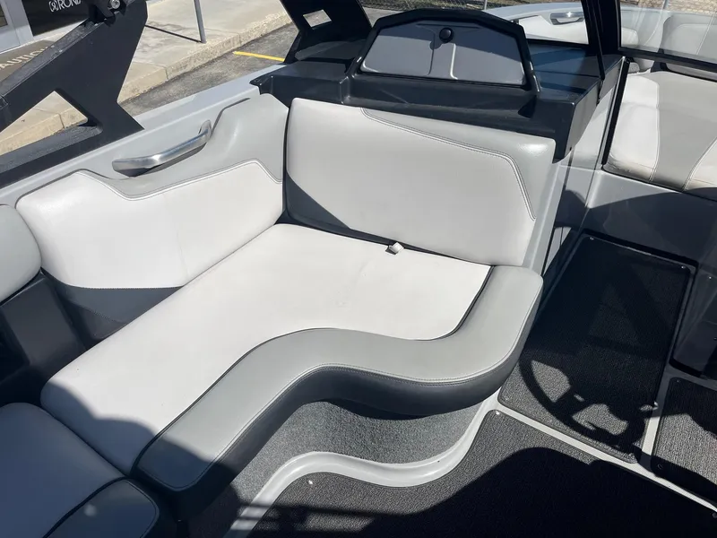 Slide: The Image of 2017 Axis Boats T22 interior seating with gray upholstery and sleek design. - 26