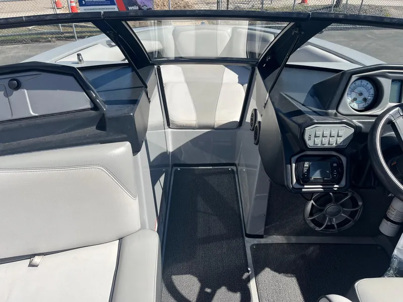 Slide: The Image of 2017 Axis Boats T22 interior with modern dashboard and seating. - 30