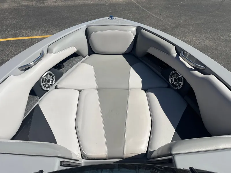 Slide: The Image of 2017 Axis Boats T22 interior with gray seating and built-in speakers. - 31