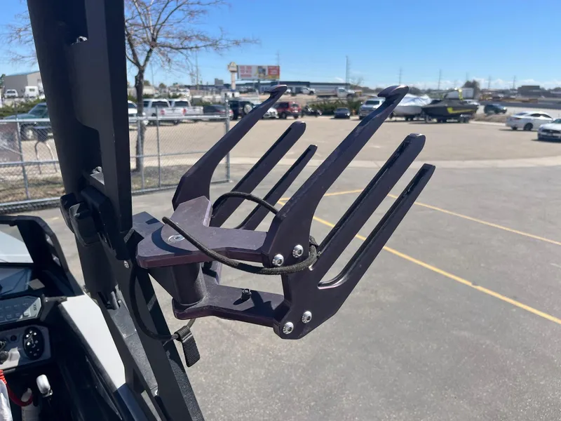 Slide: The Image of Wakeboard rack on a 2017 Axis Boats T22, parked in a lot. - 34