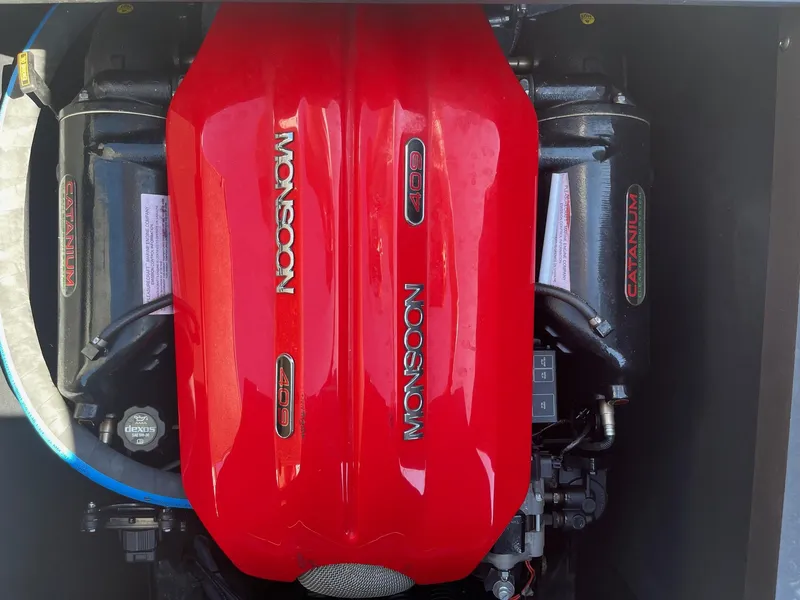 Slide: The Image of 2017 Axis Boats T22 engine, featuring a red Monsoon 409 cover. - 35
