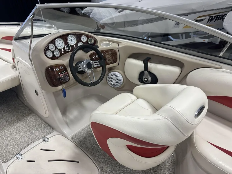Slide: The Image of Interior of a 2007 Tahoe Q8i boat with steering wheel and gauges. - 10
