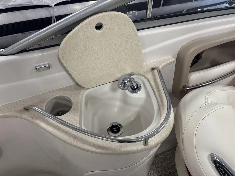 Slide: The Image of 2007 Tahoe Q8i boat interior with sink and faucet setup. - 12