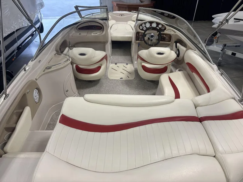 Slide: The Image of Interior of a 2007 Tahoe Q8i boat with white and red seating. - 6