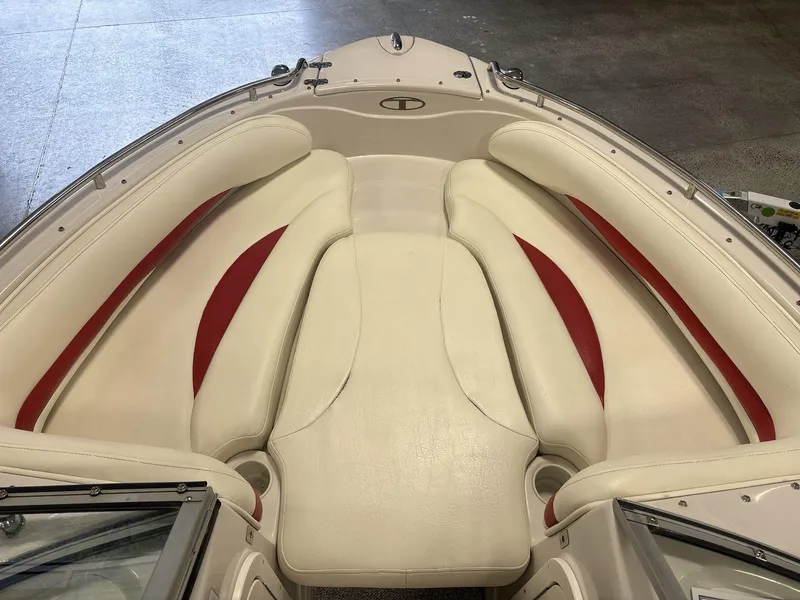 Slide: The Image of 2007 Tahoe Q8i boat interior with cream and red cushioned seating. - 7