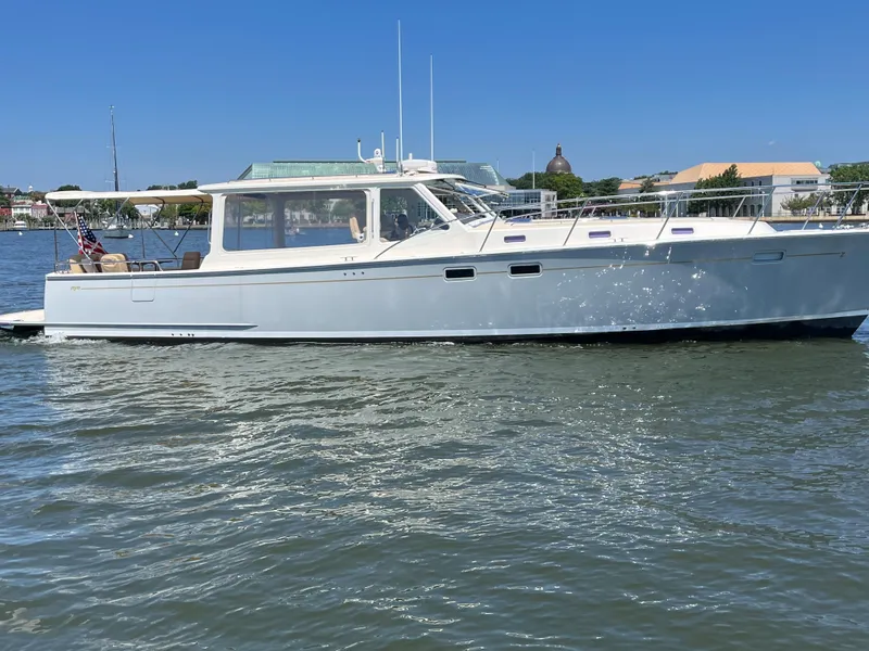 Slide: The Image of 2016 MJM 50z yacht cruising on a sunny day in calm waters. - 1