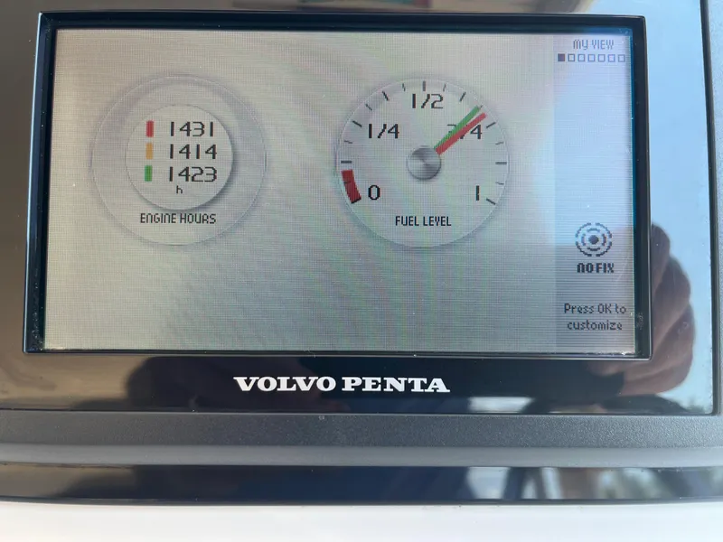 Slide: The Image of Volvo Penta display showing engine hours and fuel level on MJM 50z, 2016 model. - 13