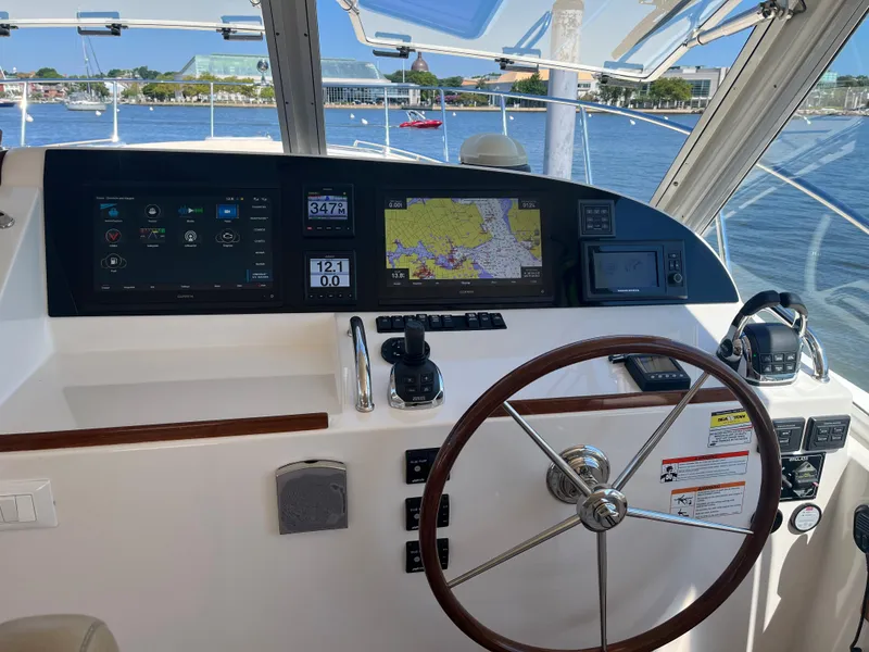 Slide: The Image of Helm of 2016 MJM 50z yacht with navigation screens and steering wheel. - 15