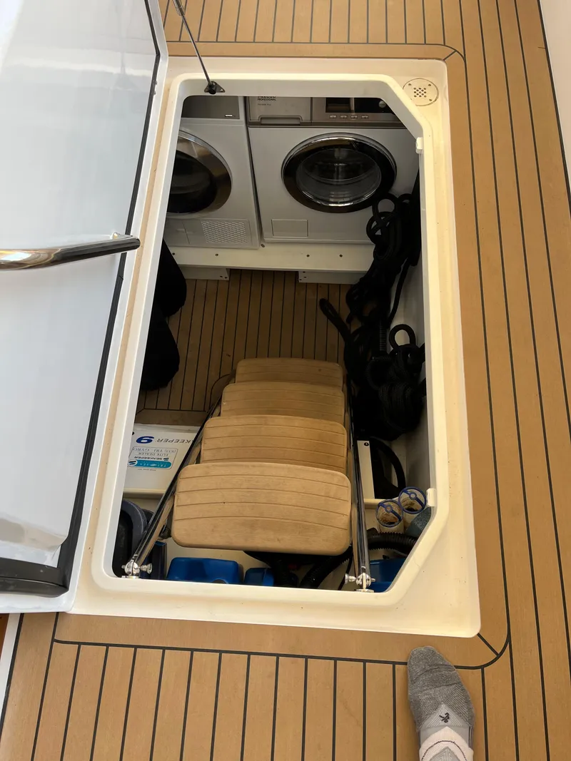 Slide: The Image of Hatch on MJM 50z yacht revealing laundry area, 2016 model. - 25