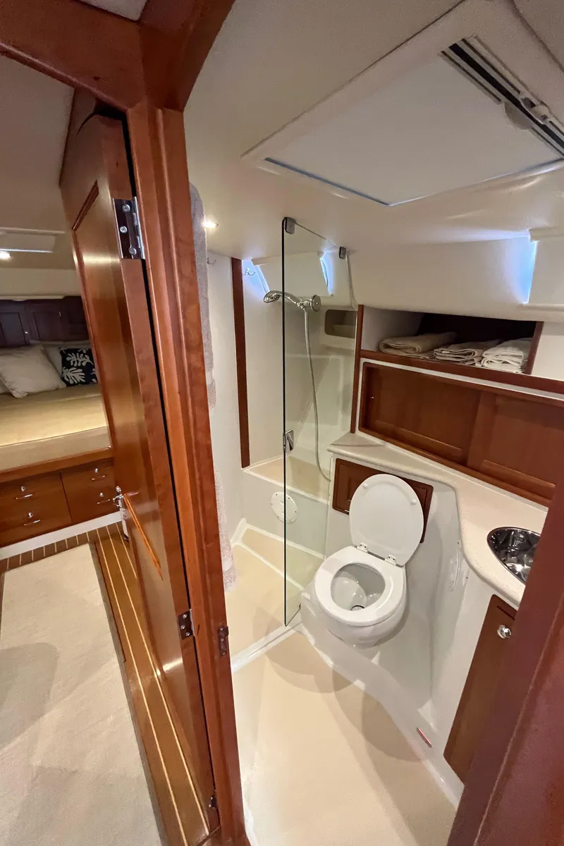 Slide: The Image of 2016 MJM 50z yacht bathroom with wooden cabinetry and modern fixtures. - 29