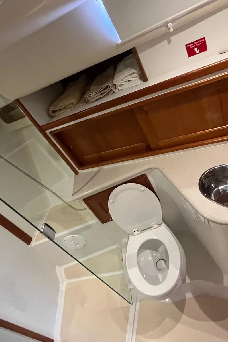 Slide: The Image of Bathroom interior of 2016 MJM 50z yacht with wooden cabinets and modern fixtures. - 32